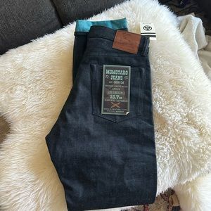 Never worn 15.7 oz Momotaro Indigo mint denim in a natural taper.